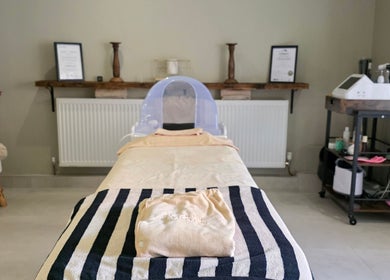 Relaxing spa room at The Secret Garden Wellness Studio, Randalstown, Northern Ireland, GB with massage bed.
