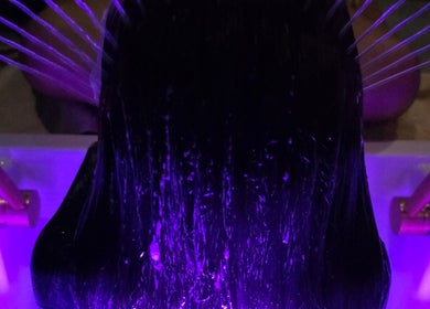 Relaxing hair treatment with purple lights at The Secret Garden Wellness Studio, Randalstown, Northern Ireland, GB.