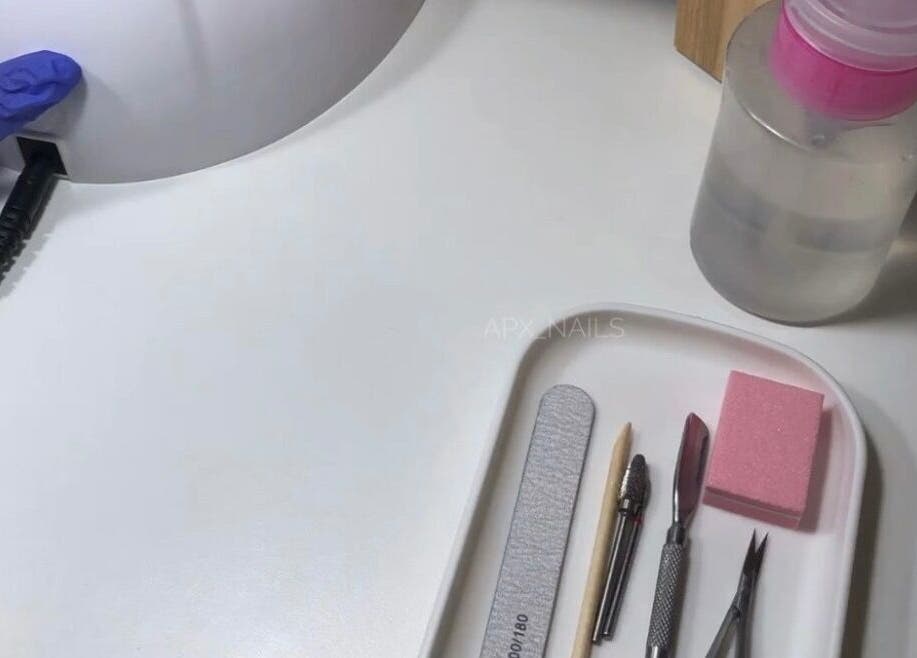 Nail care tools and UV lamp at Jaytee’s Beauty Bar, Rustenburg, North West, ZA, offer professional manicure services.