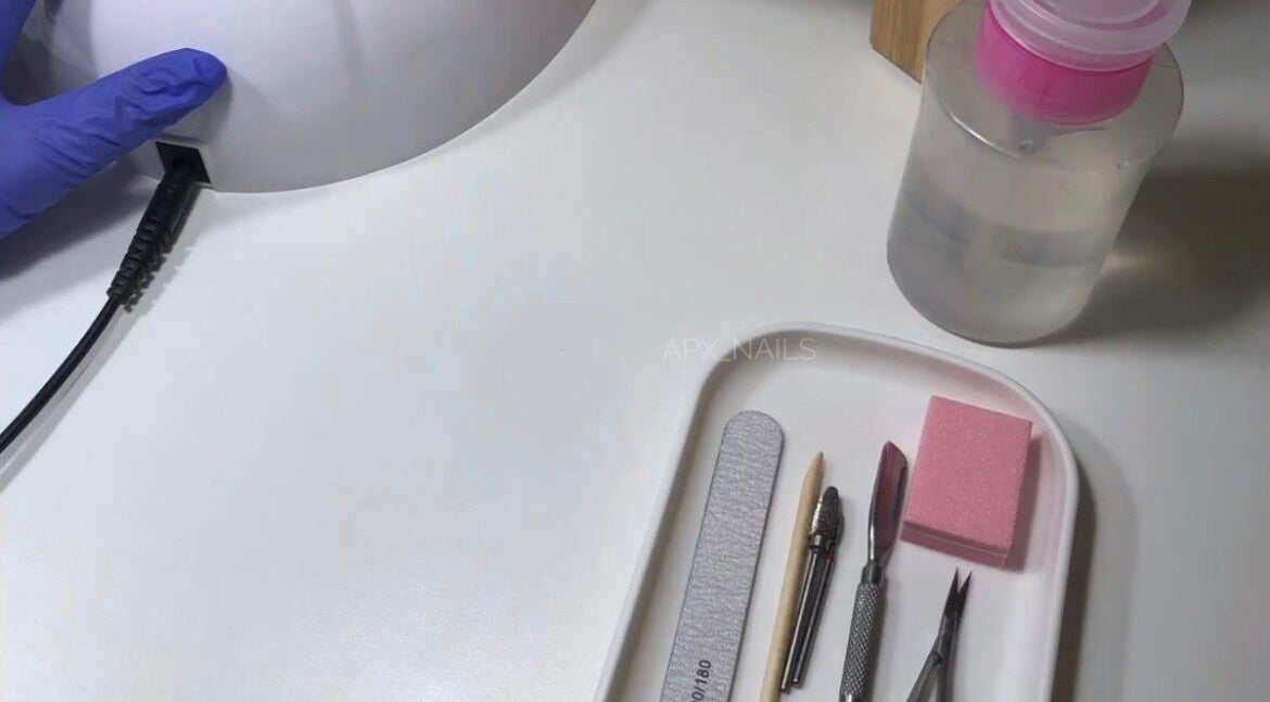 Nail care tools and UV lamp at Jaytee’s Beauty Bar, Rustenburg, North West, ZA, offer professional manicure services.