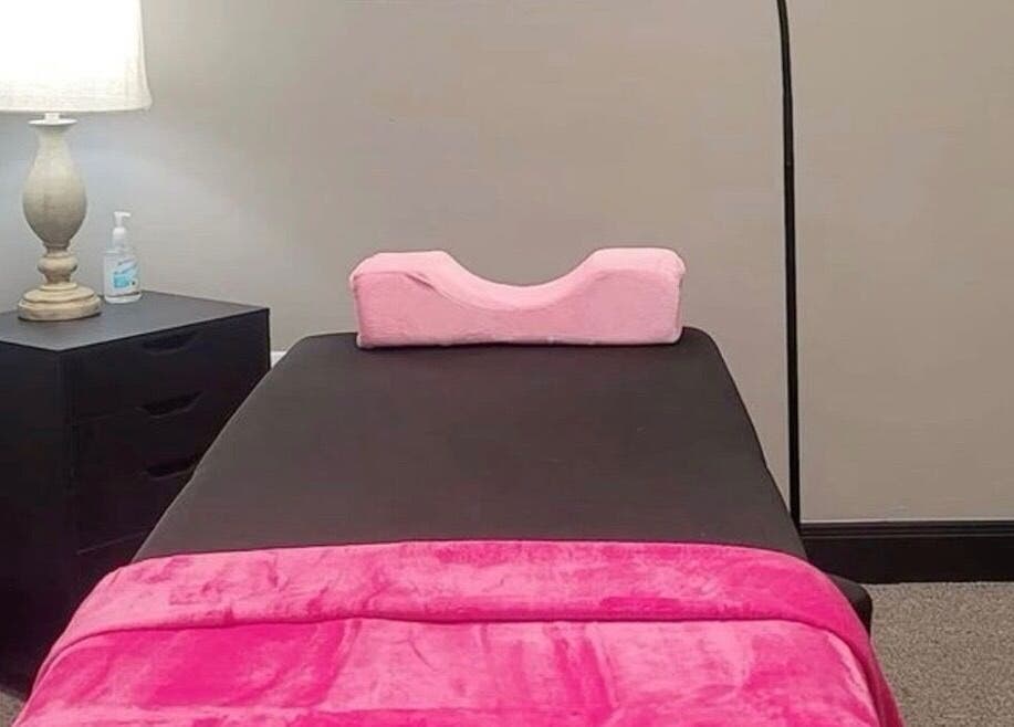 Cozy treatment room at Jaytee’s Beauty Bar in Rustenburg, North West, ZA, with pink accents and soft lighting.