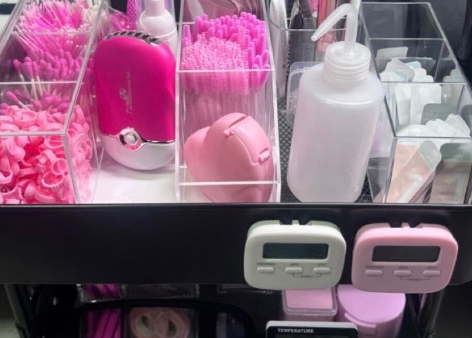 Beauty supplies at Jaytee’s Beauty Bar, Rustenburg, North West, ZA, featuring pink tools and accessories.