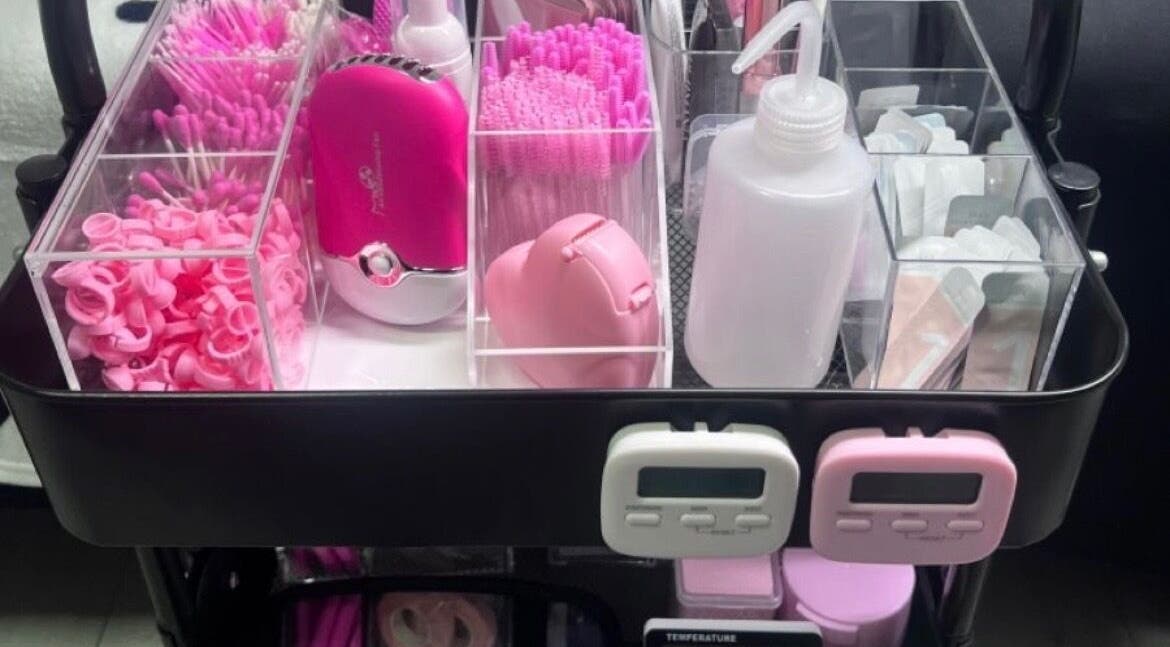 Beauty supplies at Jaytee’s Beauty Bar, Rustenburg, North West, ZA, featuring pink tools and accessories.