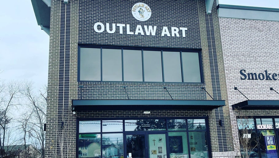 Front view of Outlaw Art Tattoo and Piercing in Lebanon, Tennessee, US showcasing its modern brick design.