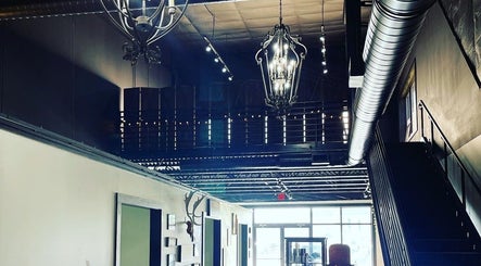 Industrial chic interior of Outlaw Art Tattoo and Piercing, Lebanon, Tennessee, US, showcasing stylish decor.