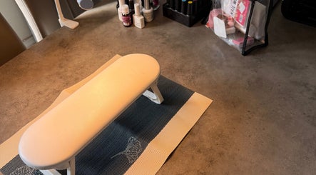 Comfortable nail station setup at Sha-Nails in Ramsey, GB with manicure tools displayed on a desk.