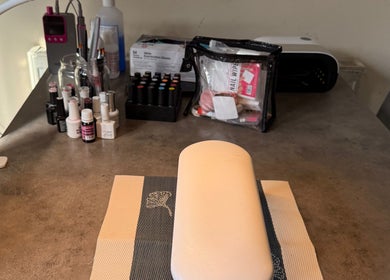 Sha-Nails Ramsey GB nail station with polishes and tools creating a professional beauty setup.