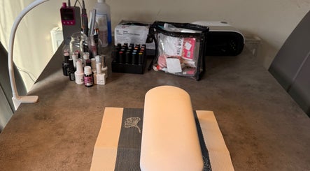 Sha-Nails Ramsey GB nail station with polishes and tools creating a professional beauty setup.
