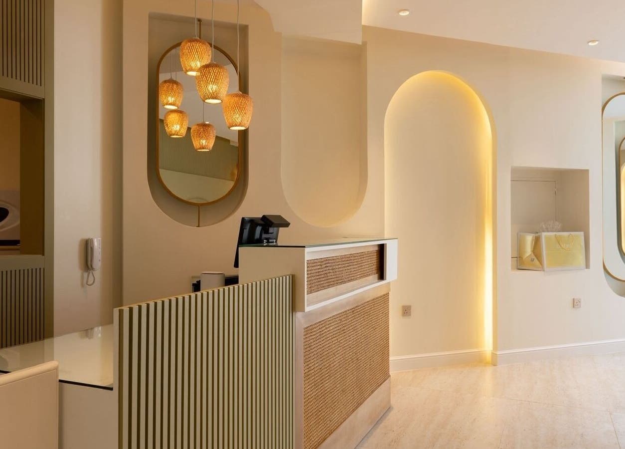 Reception area of Nails•Glow Spa&Salon - Al Rawdah, Riyadh with warm lighting and modern decor.