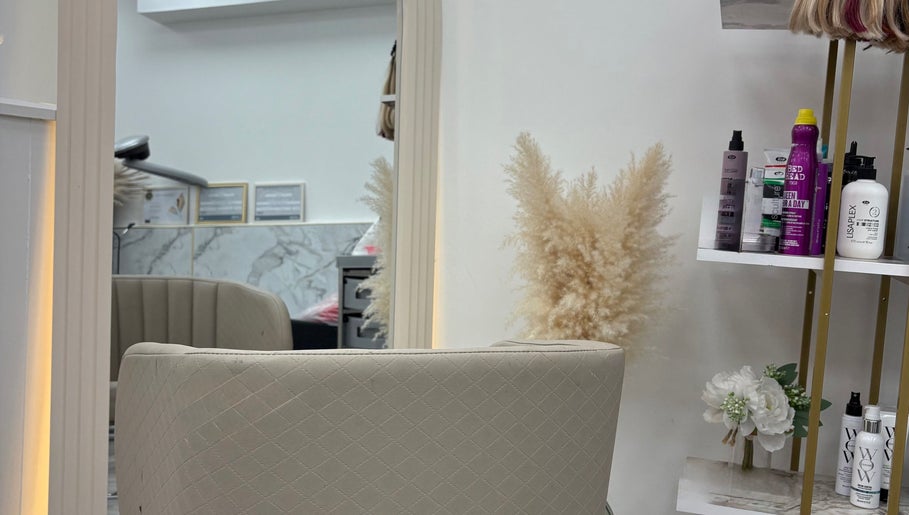 Chic salon corner at The Flahive Effect, Hereford, England, GB with stylish chair and hair products.