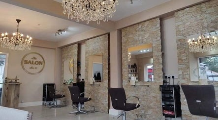 Luxurious salon interior at HBL LONGRIDGE in Longridge, England, GB with ornate chandeliers and stylish chairs.