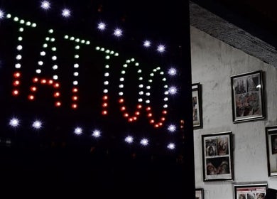 Bright neon tattoo sign at Black Ice Tattoos and Body Piercings Studio, Krugersdorp, Gauteng, ZA.