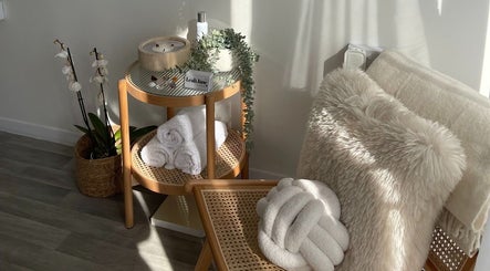 Cozy relaxation corner at Glamour Nails, Rochester, England with plush chair and elegant decor.