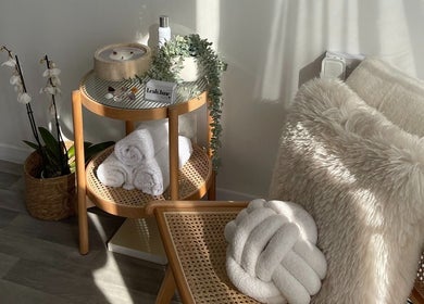 Cozy corner with fluffy cushion at Glamour Nails, Rochester, England, GB for ultimate relaxation and wellness.