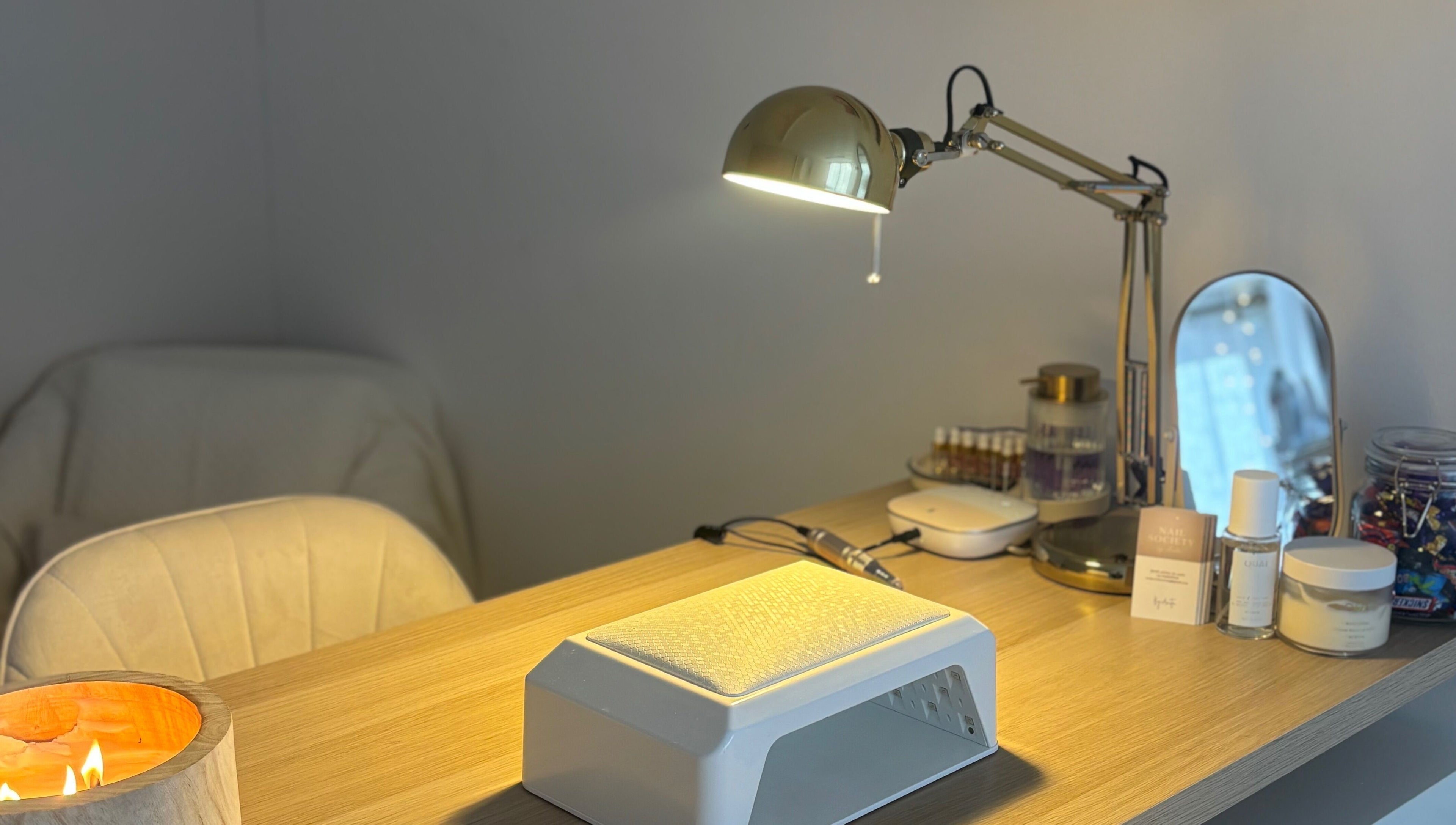 THE NAIL SOCIETY BY ANITA, Rochester, England: Nail station with lamp, products, and comfy chair.