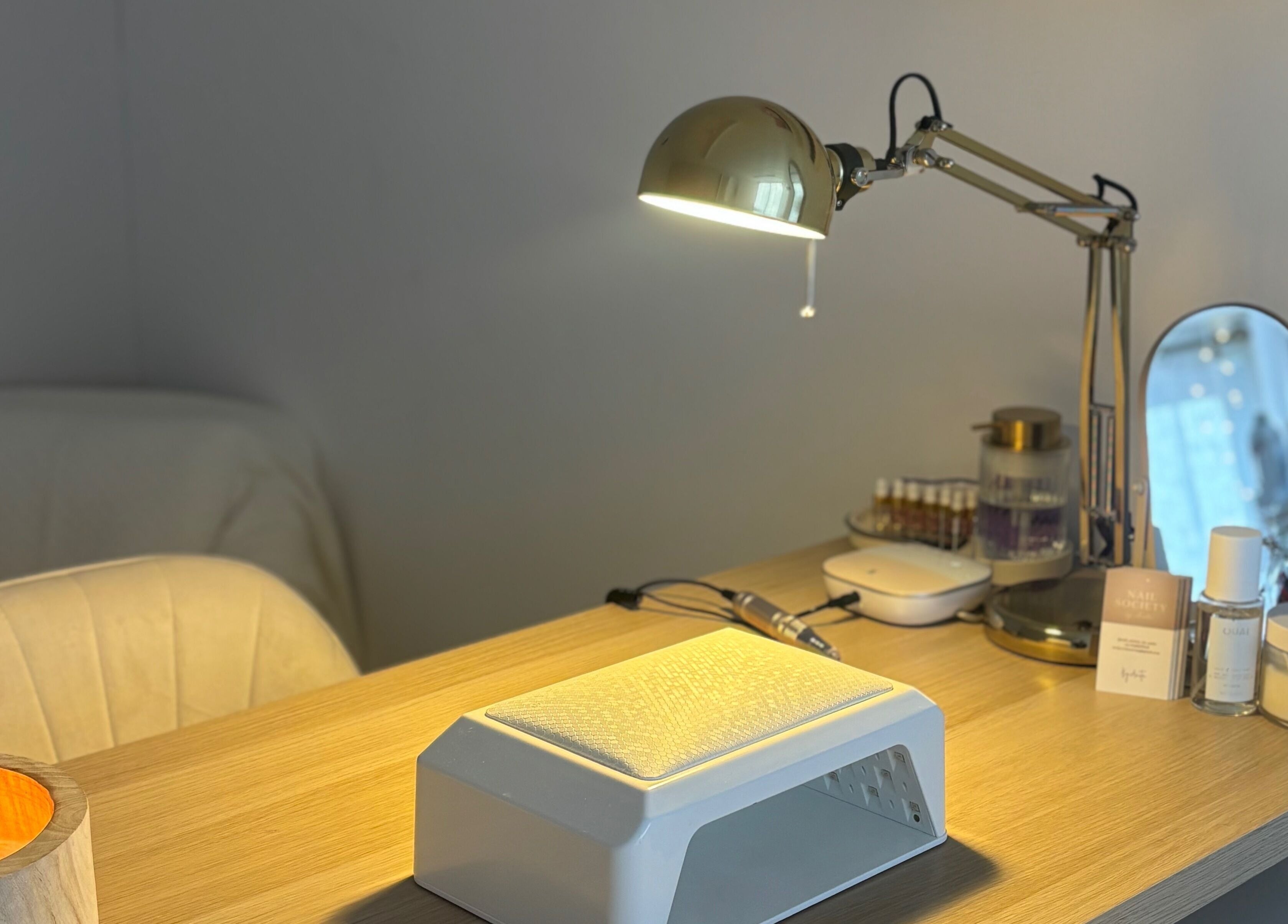 THE NAIL SOCIETY BY ANITA, Rochester, England: Nail station with lamp, products, and comfy chair.