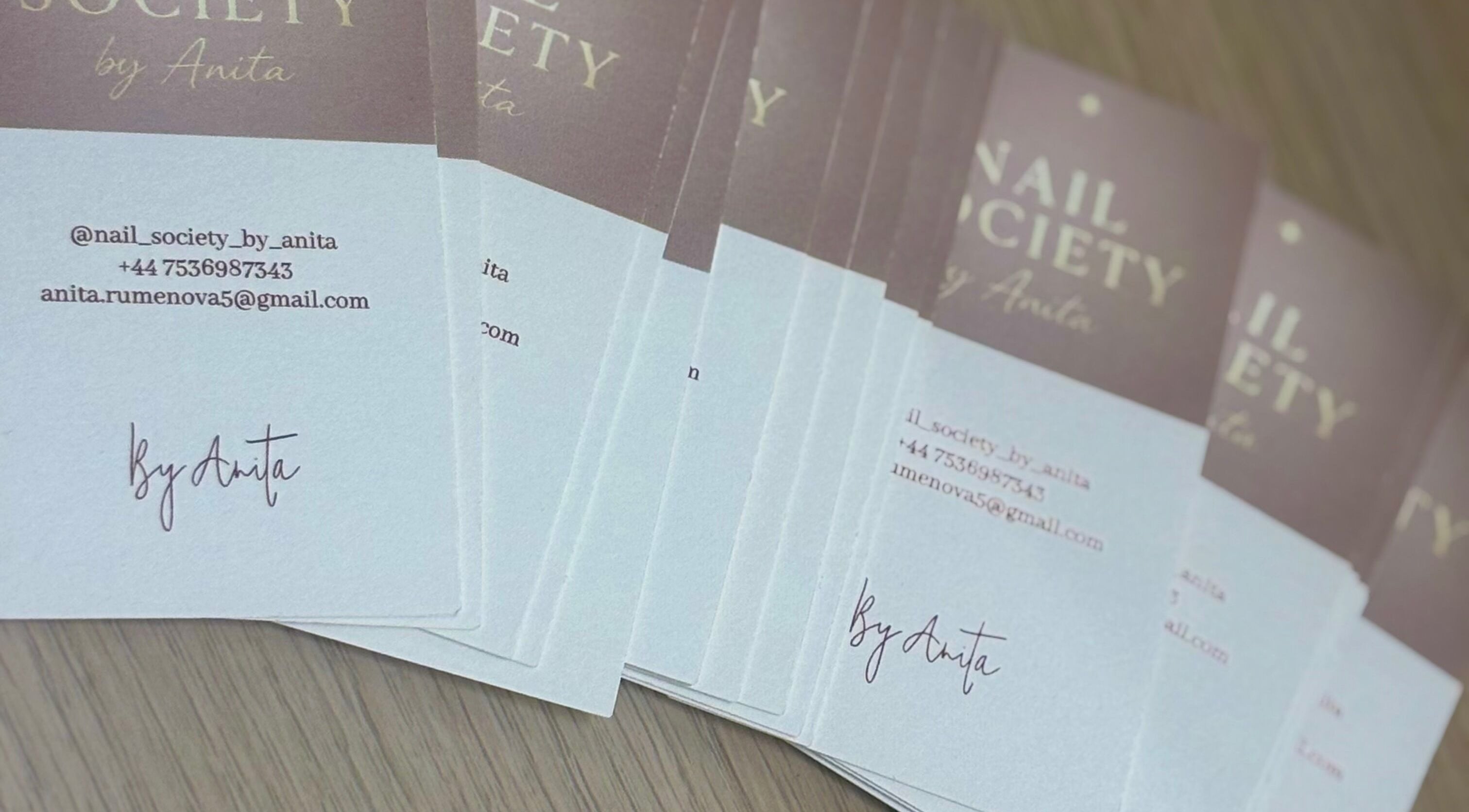 Business cards for THE NAIL SOCIETY BY ANITA, Rochester, England, GB, showcasing contact information.