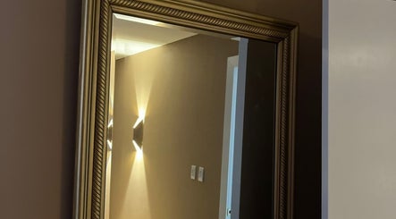 Luxurious mirror reflecting warm lighting at Detox Spa in Georgetown, KY.