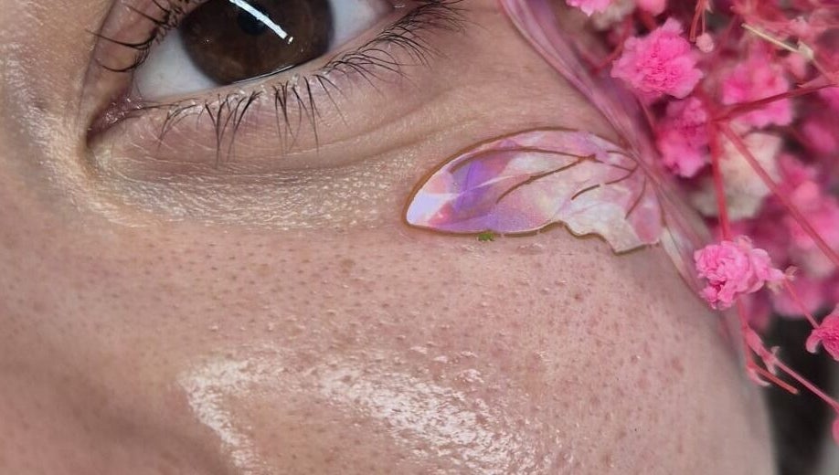 Close-up of floral eye art with pink petals at Magda Beauty Hill, Derby, England, GB.