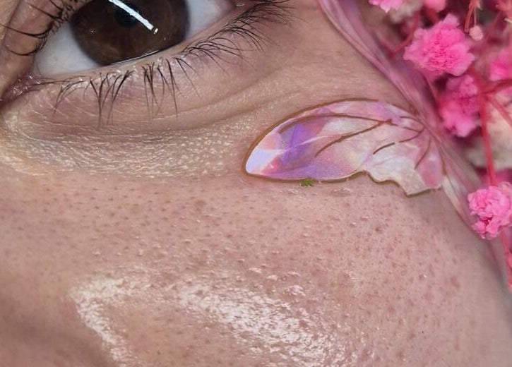 Close-up of floral eye art with pink petals at Magda Beauty Hill, Derby, England, GB.