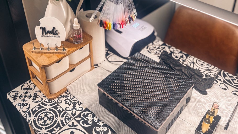 Elegant nail station at Nomad Nail Studio, Maryborough, Queensland, AU with tools and polish displays.