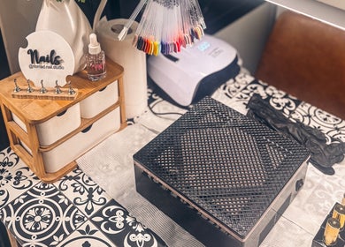 Elegant nail station at Nomad Nail Studio, Maryborough, Queensland, AU with tools and polish displays.