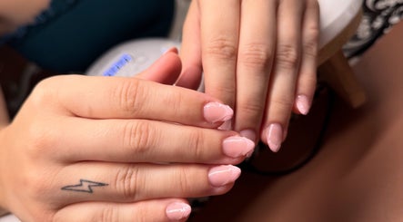 Beautifully manicured nails at Nomad Nail Studio, Maryborough, Queensland, AU. Soft pink polish glows.