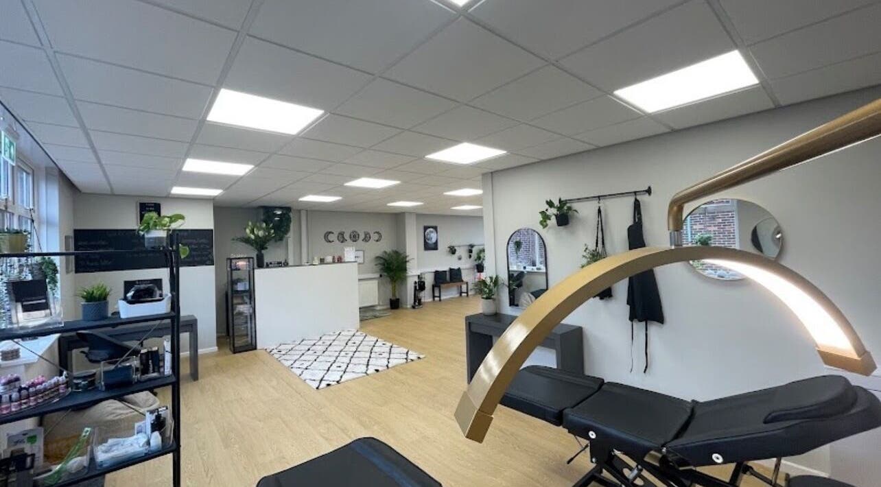 Chic interior of beauty lounge by abs in Garforth, England, GB with modern decor and treatment beds.