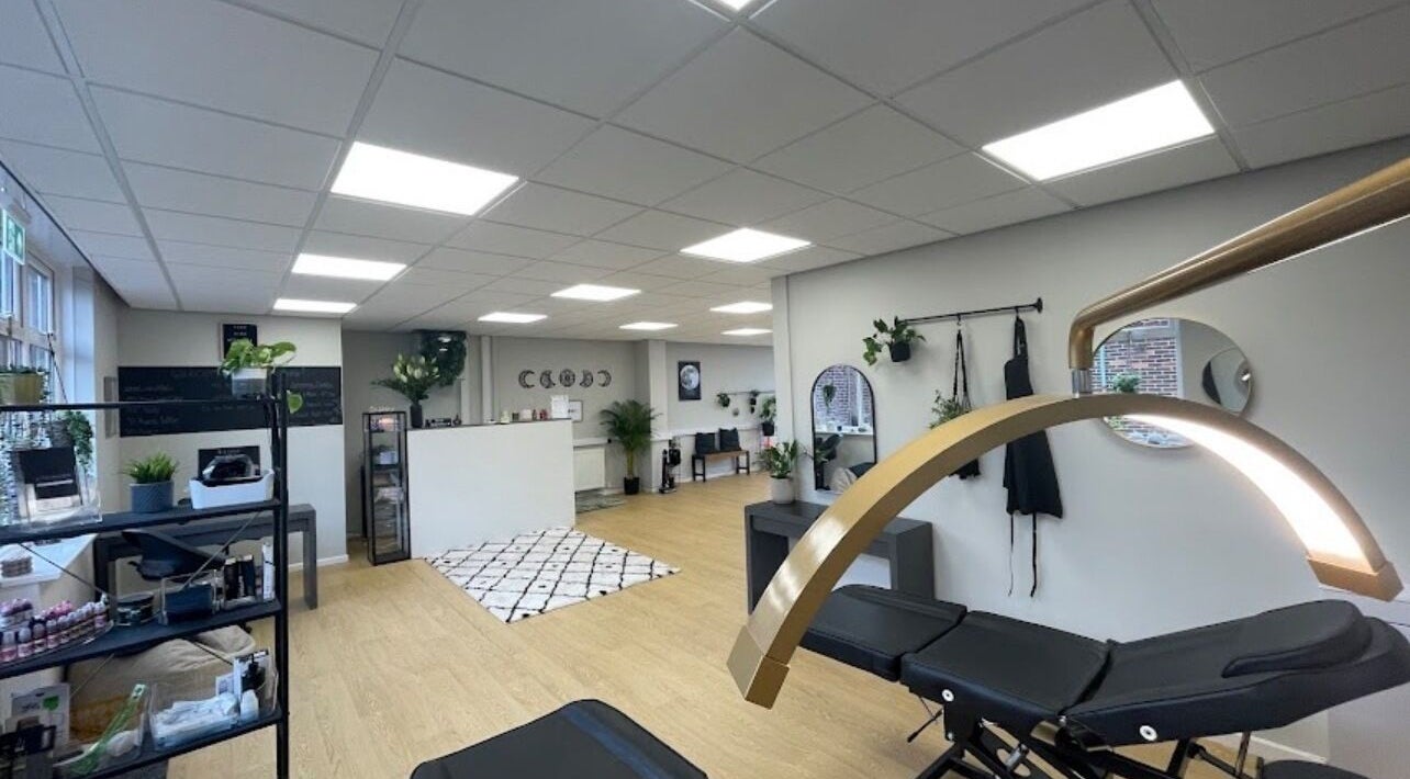 Chic interior of beauty lounge by abs in Garforth, England, GB with modern decor and treatment beds.
