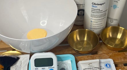 Beauty products at London Luxe Cosmetics, London, England, GB featuring cleansing solutions and skincare items.