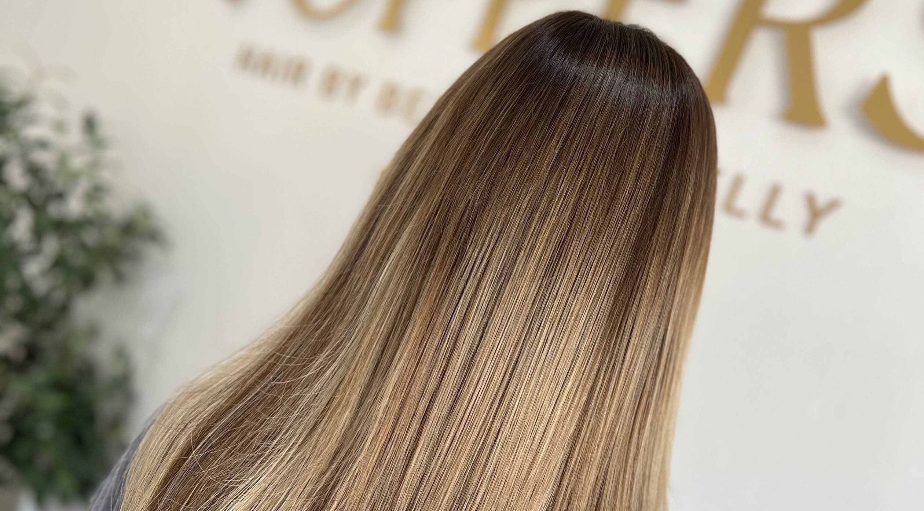 Smooth, shiny hair at Kelly Guppy Hair in Exeter, England, GB showcasing expert hair styling.