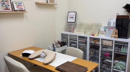 Modern nail art station at One Drop Studio, Arcadia, California, US, showcasing polish and design tools.