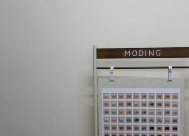 Wall-mounted color palette display at One Drop Studio, Arcadia, California, US showcasing diverse nail shades.