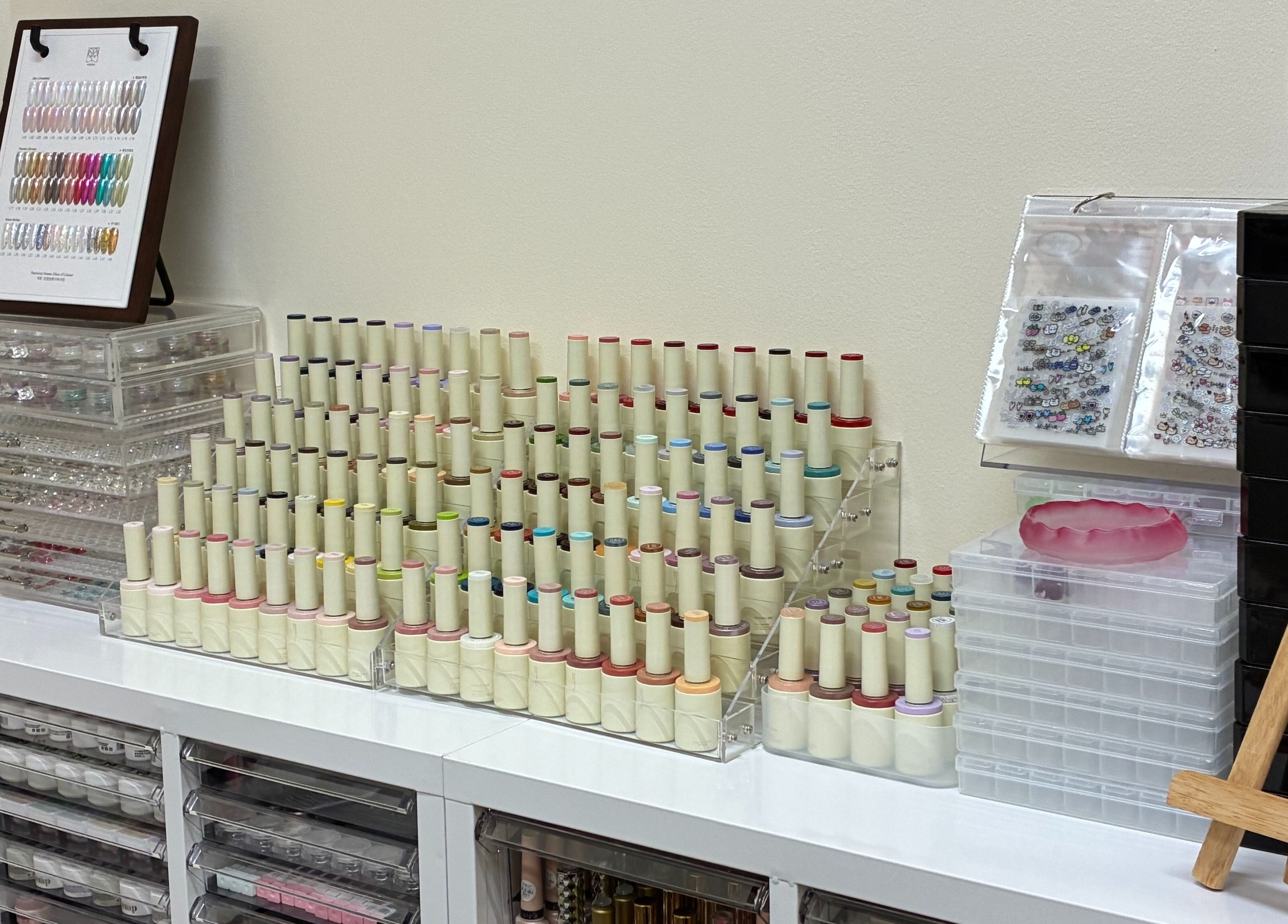 Nail polish collection at One Drop Studio, Arcadia, California, US, showcasing diverse shades and supplies.