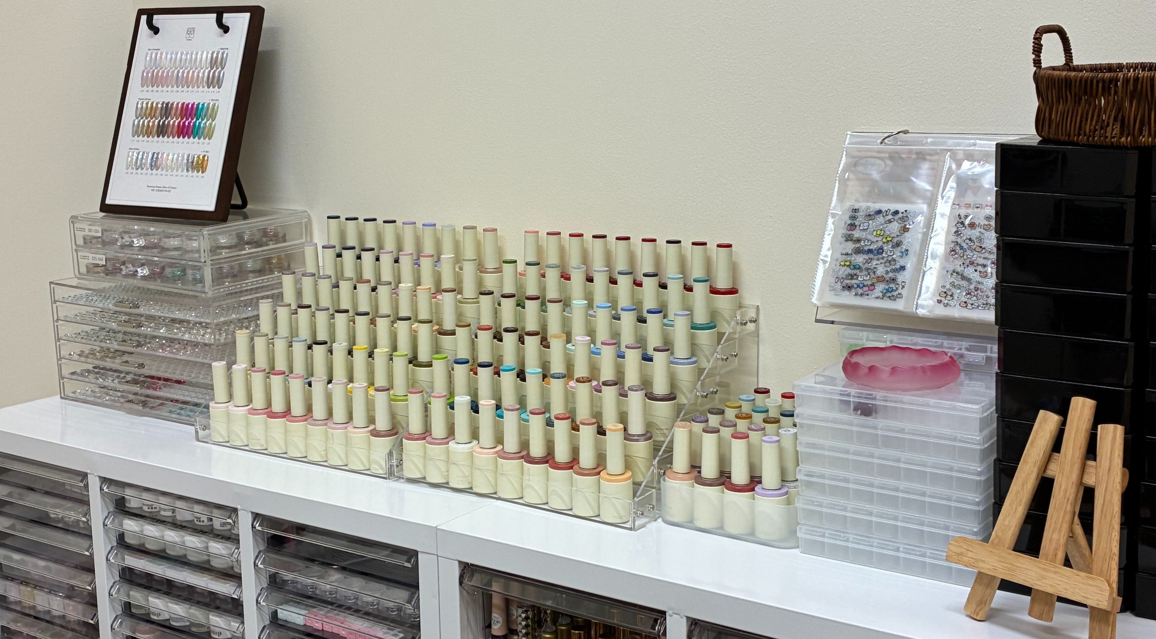 Nail polish collection at One Drop Studio, Arcadia, California, US, showcasing diverse shades and supplies.