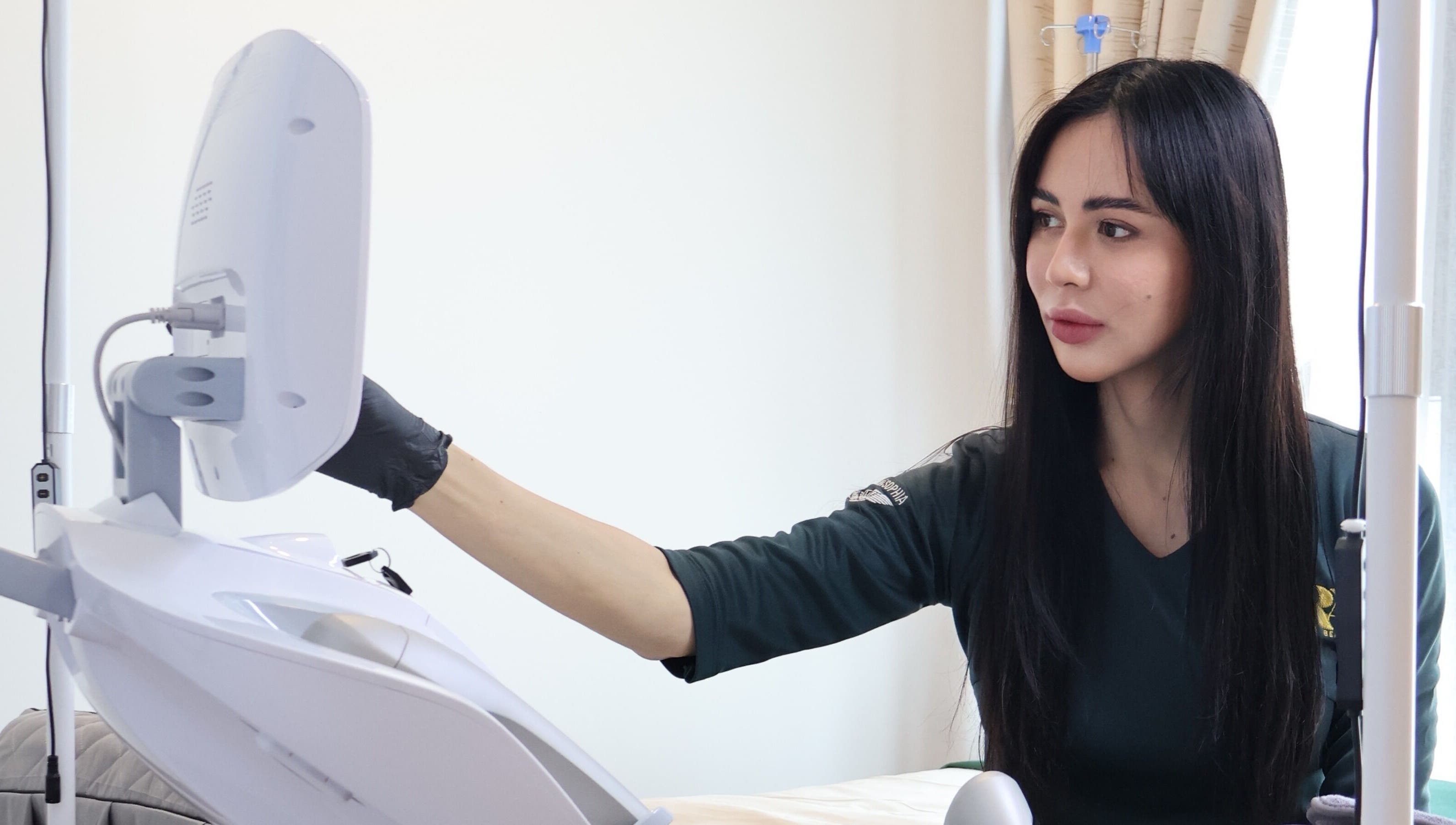 Professional at Zara Aesthetic in Kuala Lumpur using equipment for beauty treatments.