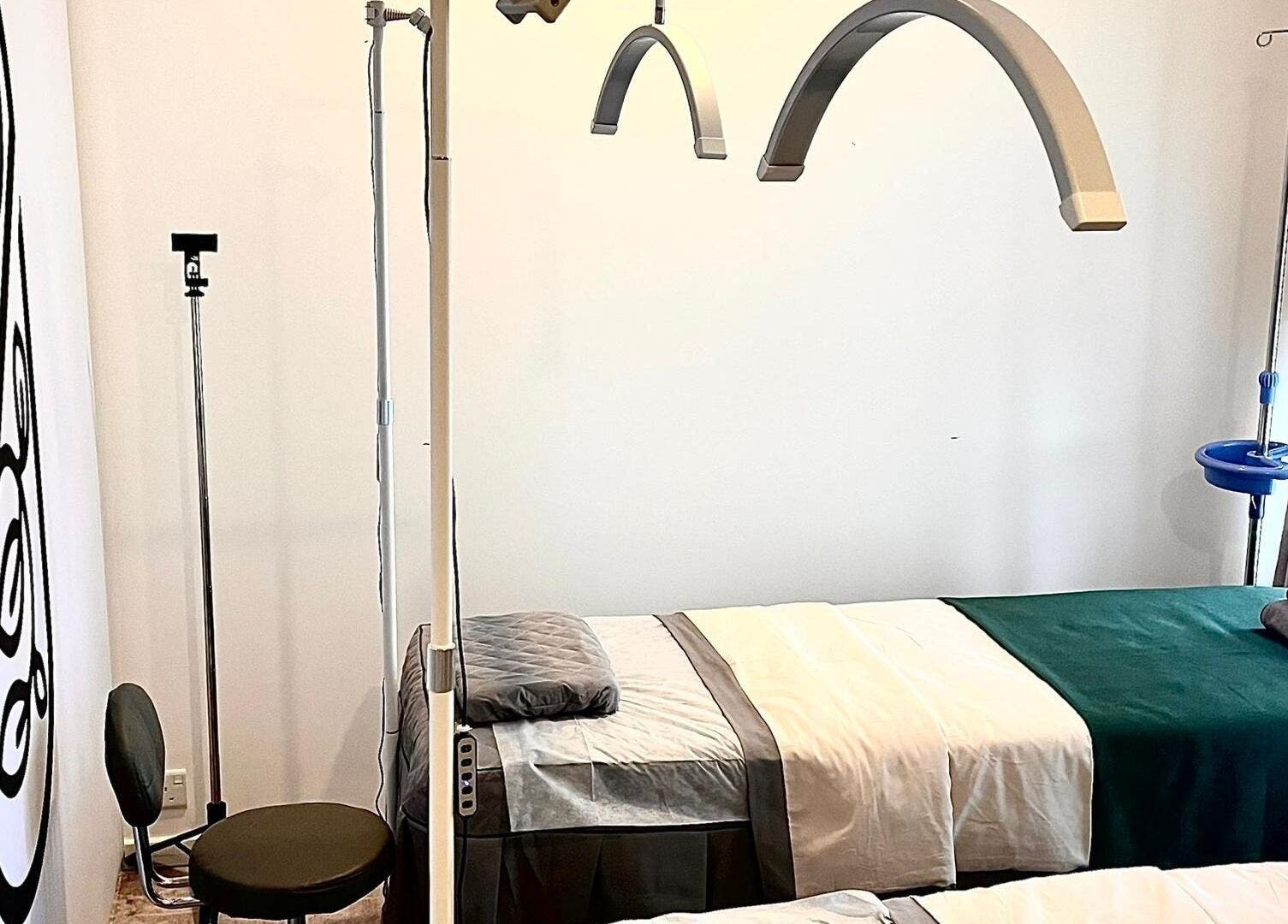 Peaceful treatment room at Zara Aesthetic, Kuala Lumpur, MY featuring modern decor and comfortable beds.