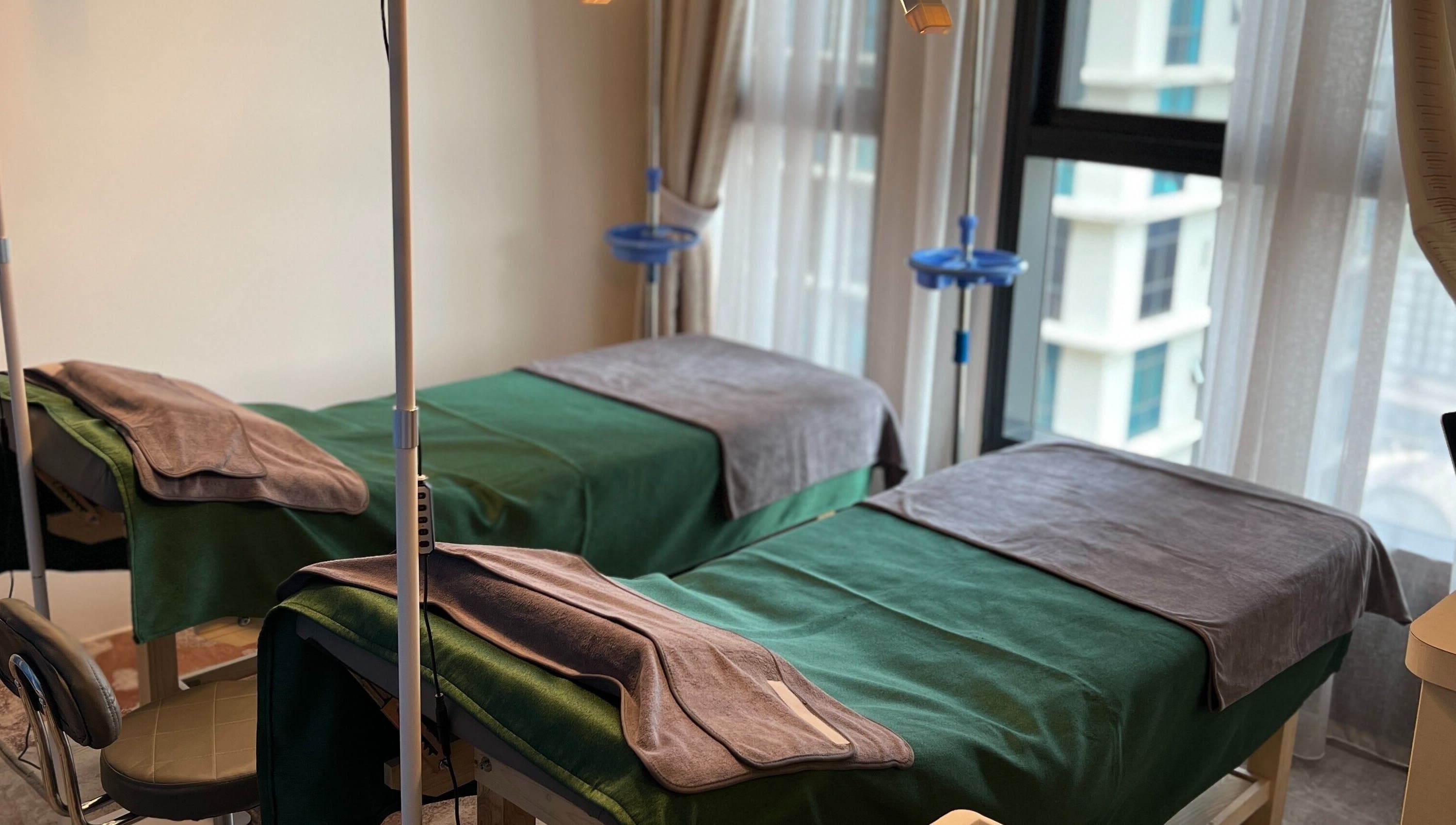 Cozy treatment beds at Zara Aesthetic, Kuala Lumpur, Wilayah Persekutuan Kuala Lumpur, MY, offering relaxation.