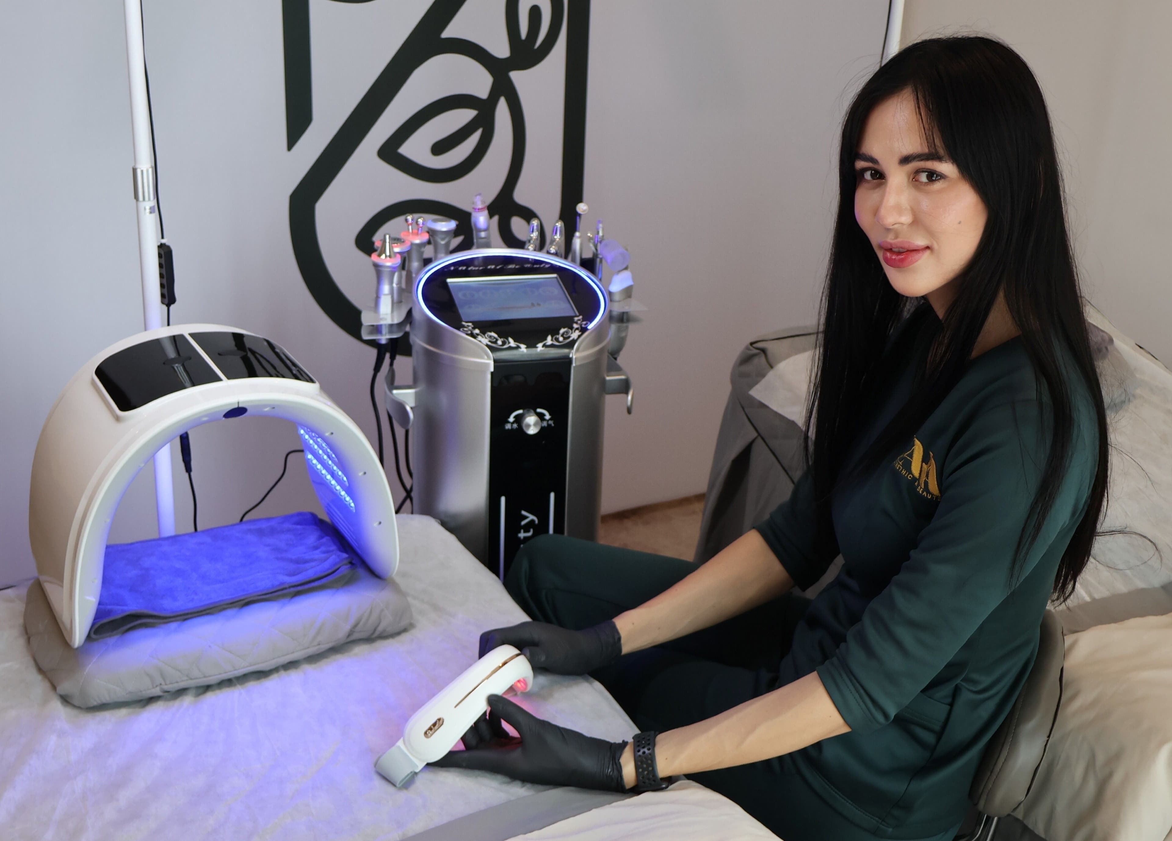 Skilled professional at Zara Aesthetic in Kuala Lumpur using advanced beauty equipment for skin treatment.