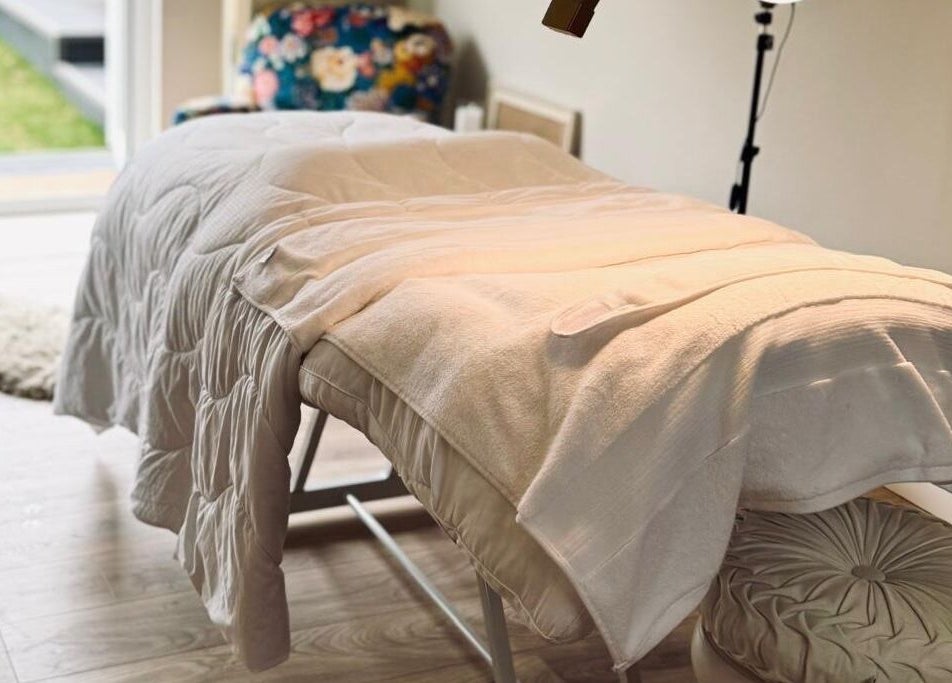 Massage bed at Kalma, Braintree, England, GB offering a serene wellness experience.