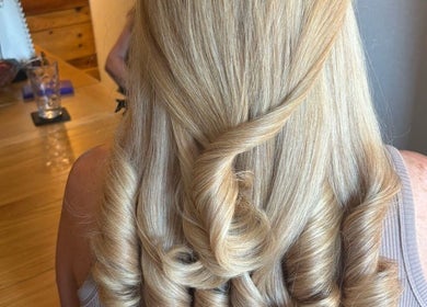 Elegant blonde curls styled at Belle Grace Hairdressing, Denton, England, GB, showcasing exquisite craftsmanship.