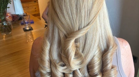 Elegant blonde curls styled at Belle Grace Hairdressing, Denton, England, GB, showcasing exquisite craftsmanship.