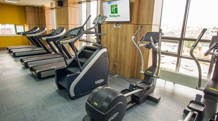 Modern gym equipment at Wellness Center in Ulaanbaatar, Ulaanbaatar, MN, featuring treadmills and ellipticals.