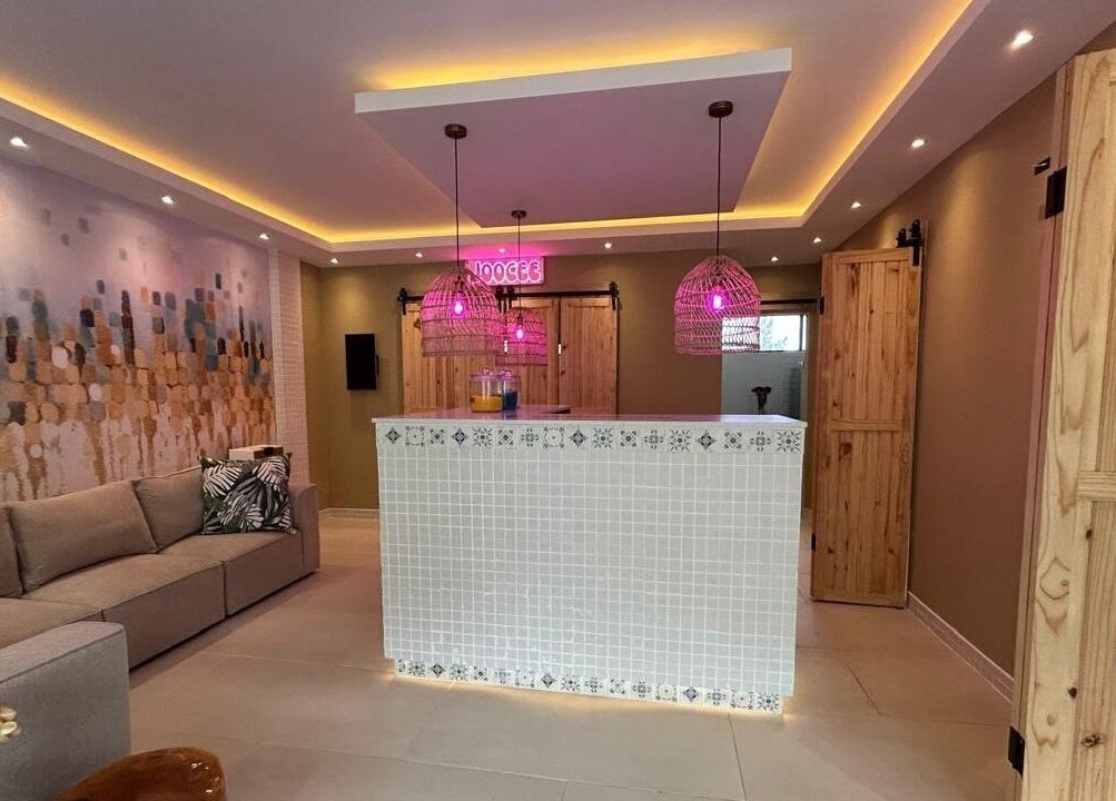 Welcoming lobby of MorrowMed in Ballito, Kwazulu-Natal, ZA, with modern decor and vibrant lighting.