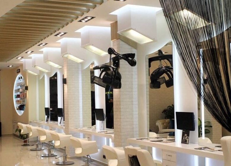 Chic interior of Beauty Tech in Tehran, Tehran Province, IR, featuring modern salon stations and sleek design.