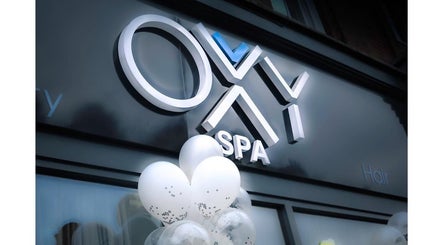 Front view of Oxy Spa LTD in London, England, GB featuring elegant signage and festive balloons.