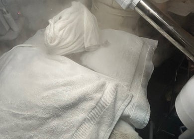 Relaxing spa steam treatment at Luxe Mere’, London, England, GB draped in soft white towels.