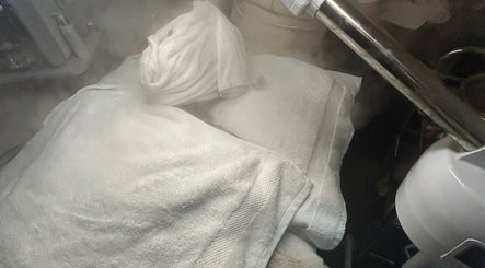 Relaxing spa steam treatment at Luxe Mere’, London, England, GB draped in soft white towels.