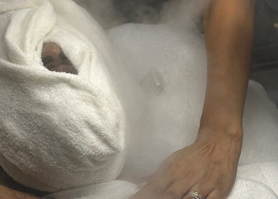 Facial steam therapy at Luxe Mere’, London, England, GB, promoting relaxation and rejuvenation.
