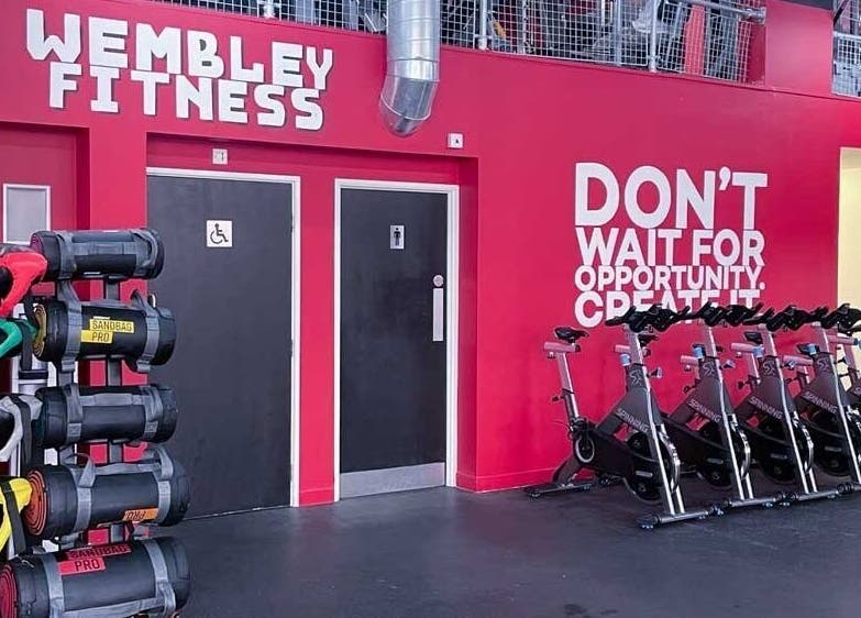 Interior of Wembley Fitness in Wembley, England, GB showing stationary bikes and workout equipment.